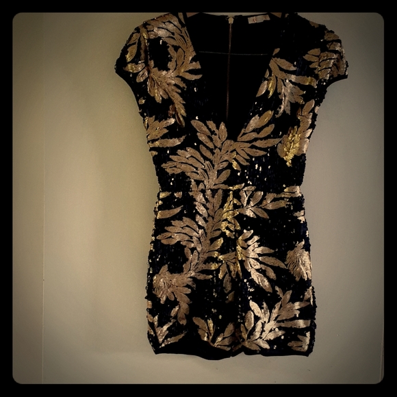 a'gaci Dresses & Skirts - Black and Gold Jumper